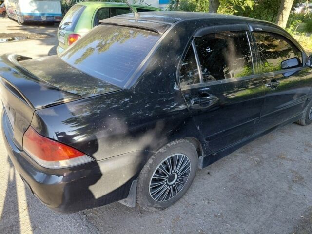 Чорний Міцубісі Lancer, об'ємом двигуна 1.6 л та пробігом 280 тис. км за 3510 $, фото 1 на Automoto.ua