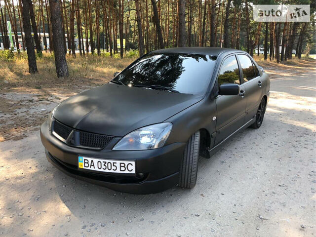 Чорний Міцубісі Lancer, об'ємом двигуна 2 л та пробігом 178 тис. км за 5500 $, фото 1 на Automoto.ua