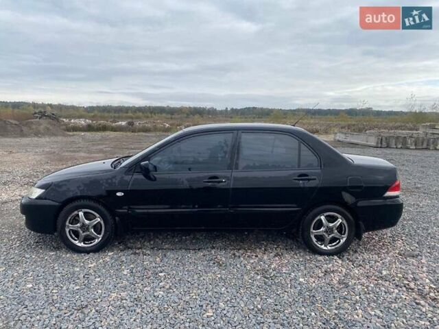 Чорний Міцубісі Lancer, об'ємом двигуна 1.6 л та пробігом 335 тис. км за 3500 $, фото 1 на Automoto.ua