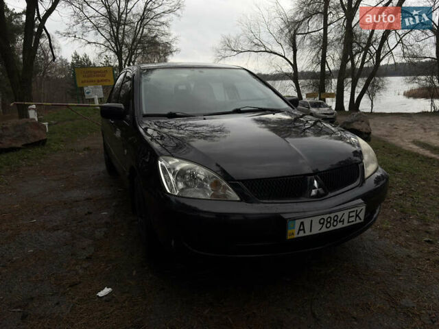 Чорний Міцубісі Lancer, об'ємом двигуна 1.58 л та пробігом 210 тис. км за 3900 $, фото 1 на Automoto.ua