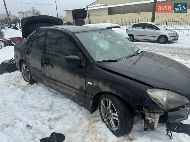 Черный Мицубиси Лансер, объемом двигателя 2 л и пробегом 251 тыс. км за 2500 $, фото 1 на Automoto.ua