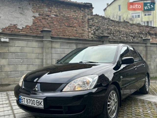 Черный Мицубиси Лансер, объемом двигателя 1.58 л и пробегом 222 тыс. км за 5200 $, фото 1 на Automoto.ua