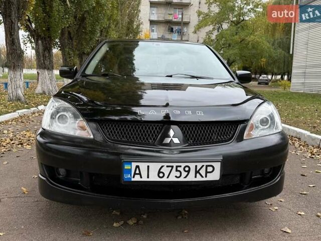 Чорний Міцубісі Lancer, об'ємом двигуна 1.58 л та пробігом 386 тис. км за 4450 $, фото 1 на Automoto.ua