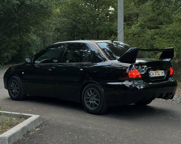 Чорний Міцубісі Lancer, об'ємом двигуна 1.6 л та пробігом 375 тис. км за 4500 $, фото 1 на Automoto.ua