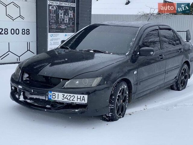 Черный Мицубиси Лансер, объемом двигателя 1.6 л и пробегом 200 тыс. км за 3200 $, фото 1 на Automoto.ua