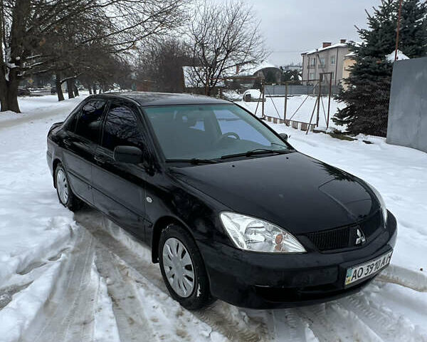 Черный Мицубиси Лансер, объемом двигателя 1.6 л и пробегом 180 тыс. км за 2850 $, фото 1 на Automoto.ua