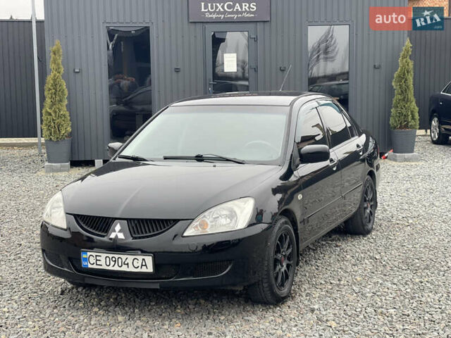 Чорний Міцубісі Lancer, об'ємом двигуна 1.58 л та пробігом 230 тис. км за 3350 $, фото 1 на Automoto.ua