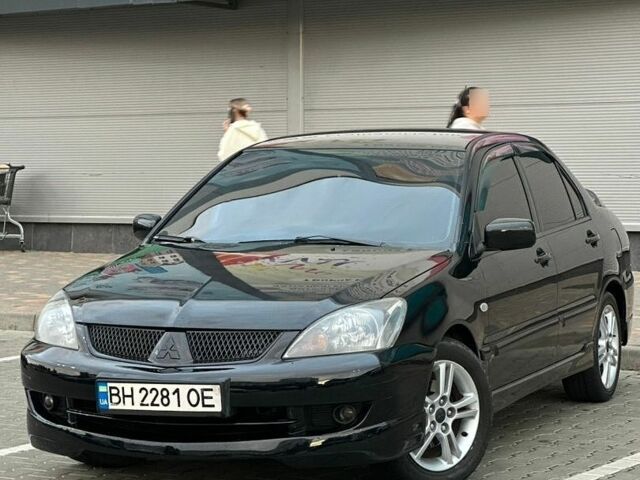 Чорний Міцубісі Lancer, об'ємом двигуна 2 л та пробігом 220 тис. км за 4800 $, фото 1 на Automoto.ua
