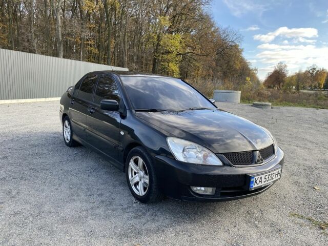 Черный Мицубиси Лансер, объемом двигателя 1.6 л и пробегом 200 тыс. км за 3400 $, фото 1 на Automoto.ua