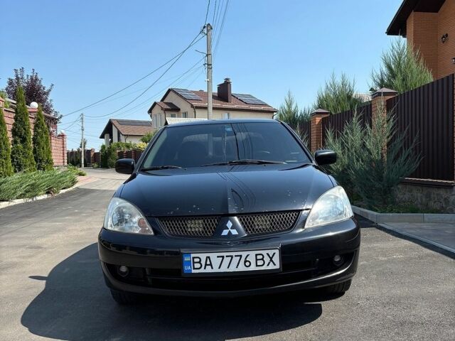 Чорний Міцубісі Lancer, об'ємом двигуна 1.58 л та пробігом 265 тис. км за 5100 $, фото 1 на Automoto.ua