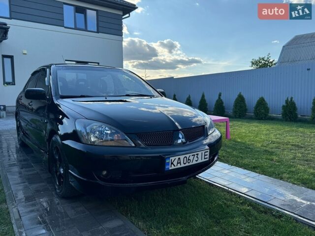 Чорний Міцубісі Lancer, об'ємом двигуна 2 л та пробігом 262 тис. км за 3500 $, фото 1 на Automoto.ua