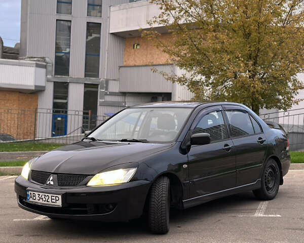 Чорний Міцубісі Lancer, об'ємом двигуна 1.58 л та пробігом 230 тис. км за 4350 $, фото 1 на Automoto.ua