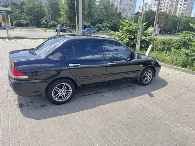 Чорний Міцубісі Lancer, об'ємом двигуна 1.6 л та пробігом 237 тис. км за 3714 $, фото 1 на Automoto.ua