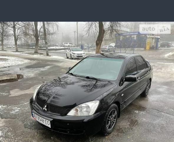 Черный Мицубиси Лансер, объемом двигателя 1.6 л и пробегом 200 тыс. км за 4200 $, фото 1 на Automoto.ua