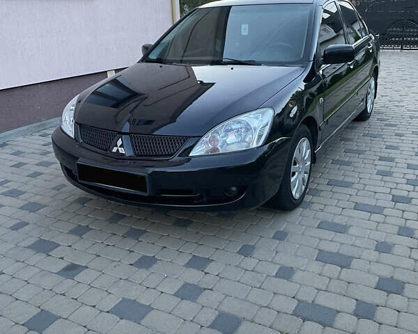 Чорний Міцубісі Lancer, об'ємом двигуна 1.6 л та пробігом 170 тис. км за 4900 $, фото 1 на Automoto.ua