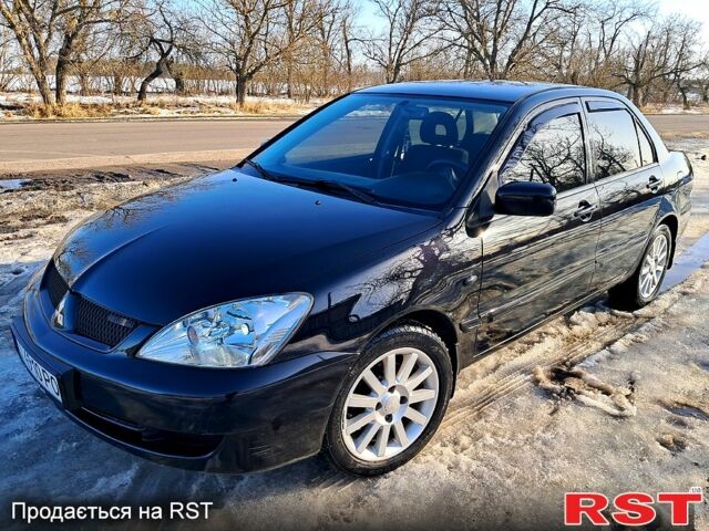 Чорний Міцубісі Lancer, об'ємом двигуна 1.6 л та пробігом 23700 тис. км за 3999 $, фото 1 на Automoto.ua