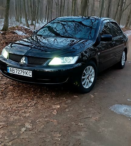 Чорний Міцубісі Lancer, об'ємом двигуна 1.6 л та пробігом 345 тис. км за 3700 $, фото 1 на Automoto.ua