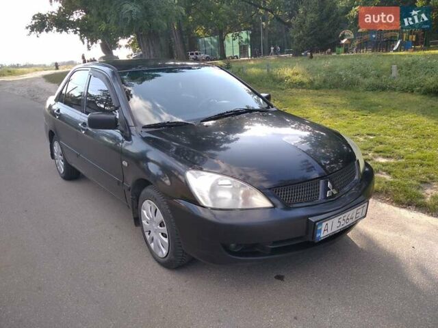 Чорний Міцубісі Lancer, об'ємом двигуна 1.58 л та пробігом 520 тис. км за 3400 $, фото 1 на Automoto.ua