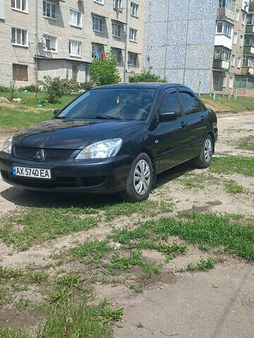Чорний Міцубісі Lancer, об'ємом двигуна 1.58 л та пробігом 277 тис. км за 3900 $, фото 1 на Automoto.ua