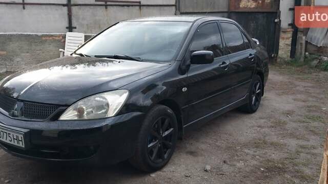 Чорний Міцубісі Lancer, об'ємом двигуна 1.59 л та пробігом 185 тис. км за 4900 $, фото 1 на Automoto.ua