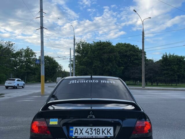 Черный Мицубиси Лансер, объемом двигателя 1.6 л и пробегом 270 тыс. км за 3953 $, фото 1 на Automoto.ua