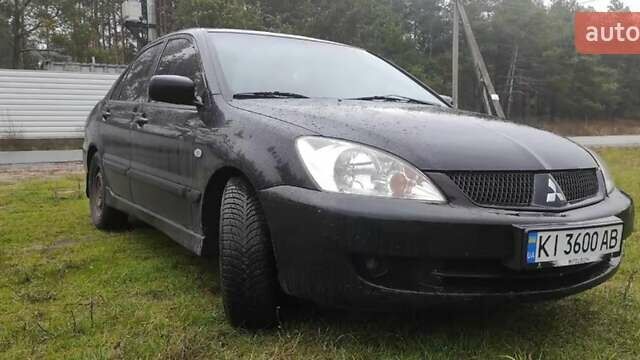 Чорний Міцубісі Lancer, об'ємом двигуна 1.58 л та пробігом 140 тис. км за 2999 $, фото 1 на Automoto.ua