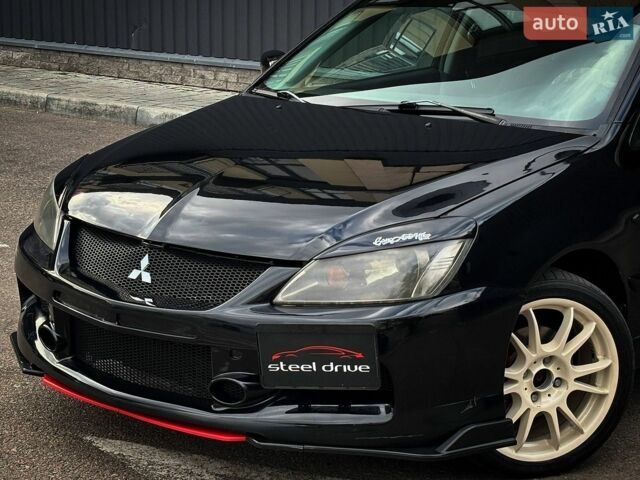 Чорний Міцубісі Lancer, об'ємом двигуна 1.6 л та пробігом 256 тис. км за 4999 $, фото 1 на Automoto.ua