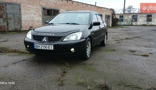 Чорний Міцубісі Lancer, об'ємом двигуна 1.6 л та пробігом 230 тис. км за 3250 $, фото 1 на Automoto.ua
