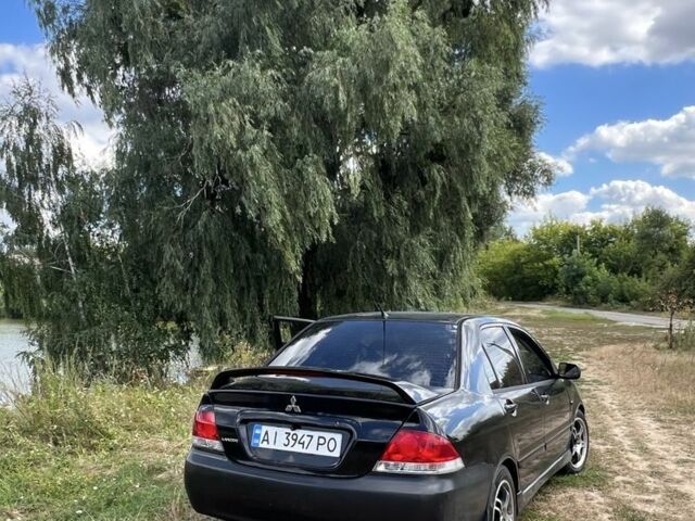Чорний Міцубісі Lancer, об'ємом двигуна 2 л та пробігом 365 тис. км за 3300 $, фото 1 на Automoto.ua