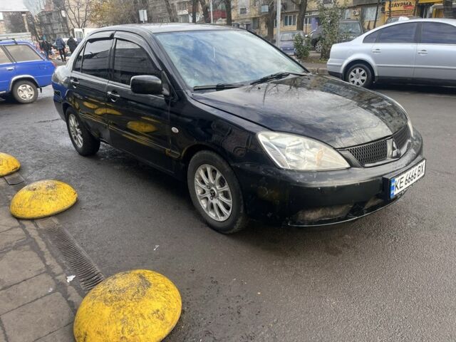 Черный Мицубиси Лансер, объемом двигателя 1.6 л и пробегом 299 тыс. км за 3480 $, фото 1 на Automoto.ua
