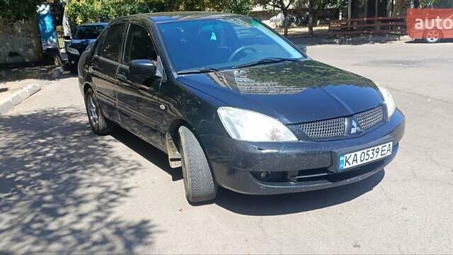 Чорний Міцубісі Lancer, об'ємом двигуна 1.6 л та пробігом 240 тис. км за 3900 $, фото 1 на Automoto.ua