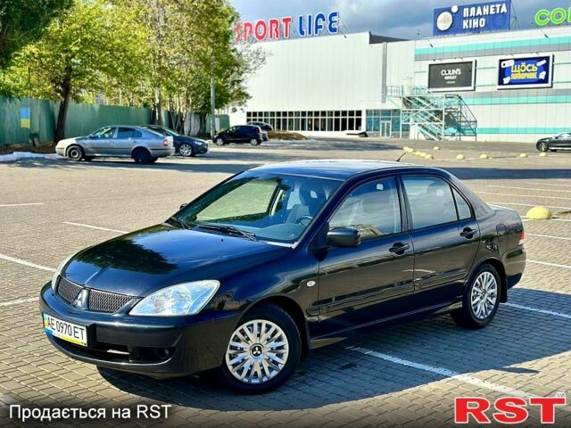 Черный Мицубиси Лансер, объемом двигателя 1.6 л и пробегом 208 тыс. км за 4999 $, фото 1 на Automoto.ua