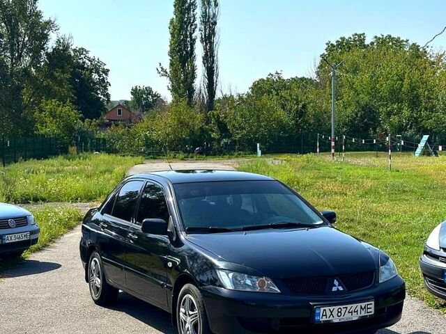 Черный Мицубиси Лансер, объемом двигателя 1.6 л и пробегом 230 тыс. км за 3200 $, фото 1 на Automoto.ua