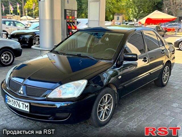 Чорний Міцубісі Lancer, об'ємом двигуна 1.6 л та пробігом 176 тис. км за 3777 $, фото 1 на Automoto.ua