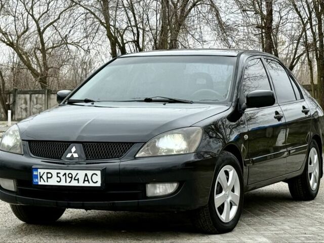 Черный Мицубиси Лансер, объемом двигателя 1.6 л и пробегом 196 тыс. км за 4400 $, фото 1 на Automoto.ua