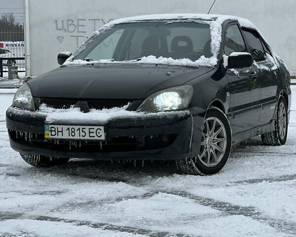 Черный Мицубиси Лансер, объемом двигателя 2 л и пробегом 420 тыс. км за 3599 $, фото 1 на Automoto.ua