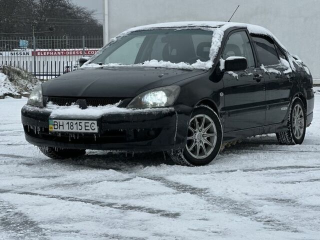 Черный Мицубиси Лансер, объемом двигателя 2 л и пробегом 420 тыс. км за 3599 $, фото 1 на Automoto.ua