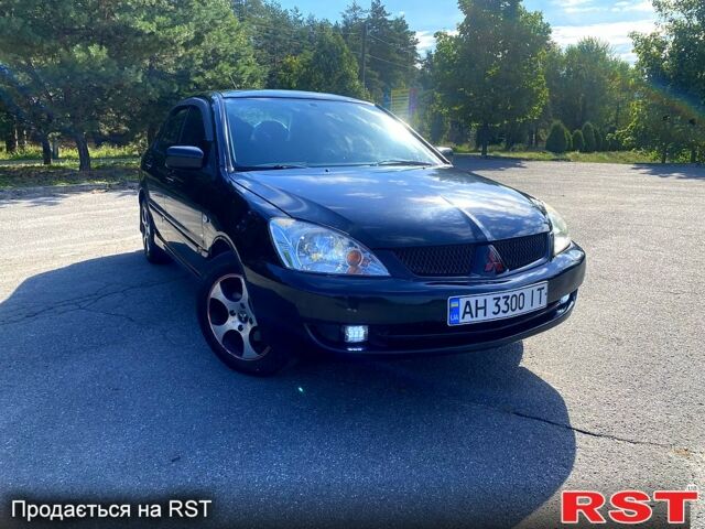 Чорний Міцубісі Lancer, об'ємом двигуна 1.6 л та пробігом 244 тис. км за 4100 $, фото 1 на Automoto.ua