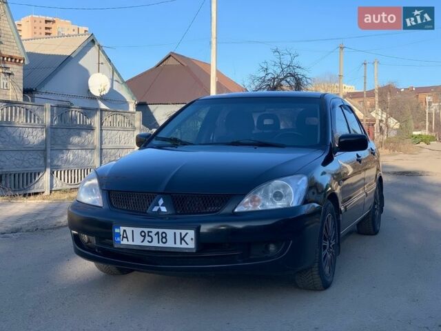 Черный Мицубиси Лансер, объемом двигателя 1.58 л и пробегом 253 тыс. км за 3850 $, фото 1 на Automoto.ua