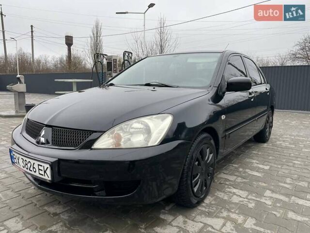 Чорний Міцубісі Lancer, об'ємом двигуна 1.58 л та пробігом 282 тис. км за 4100 $, фото 1 на Automoto.ua