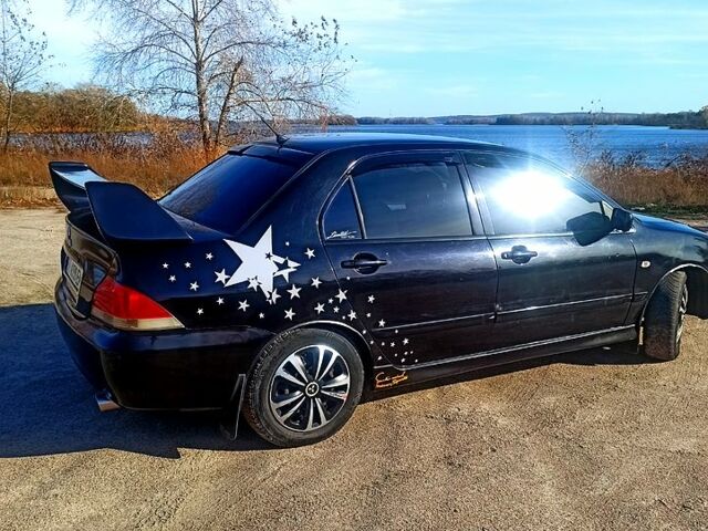 Черный Мицубиси Лансер, объемом двигателя 1.6 л и пробегом 25500 тыс. км за 3700 $, фото 1 на Automoto.ua