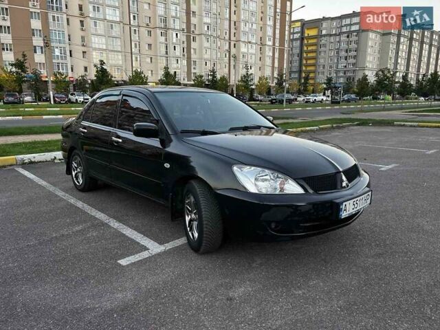 Чорний Міцубісі Lancer, об'ємом двигуна 1.58 л та пробігом 329 тис. км за 3500 $, фото 1 на Automoto.ua
