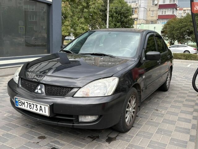 Чорний Міцубісі Lancer, об'ємом двигуна 1.58 л та пробігом 266 тис. км за 4400 $, фото 1 на Automoto.ua