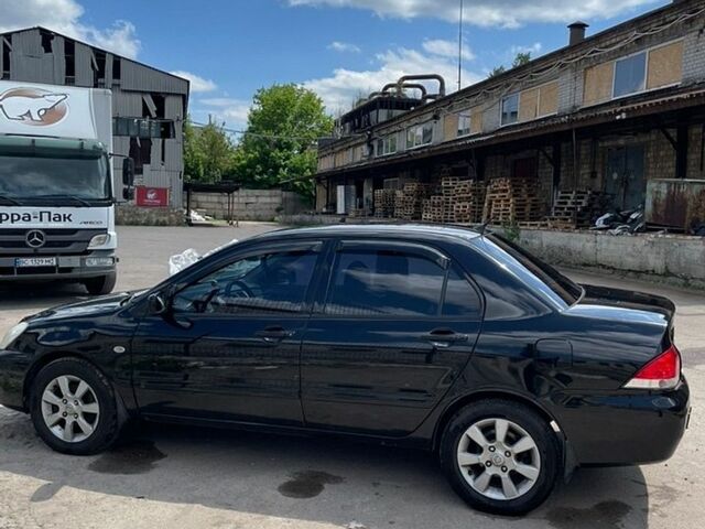 Чорний Міцубісі Lancer, об'ємом двигуна 1.58 л та пробігом 331 тис. км за 3300 $, фото 1 на Automoto.ua