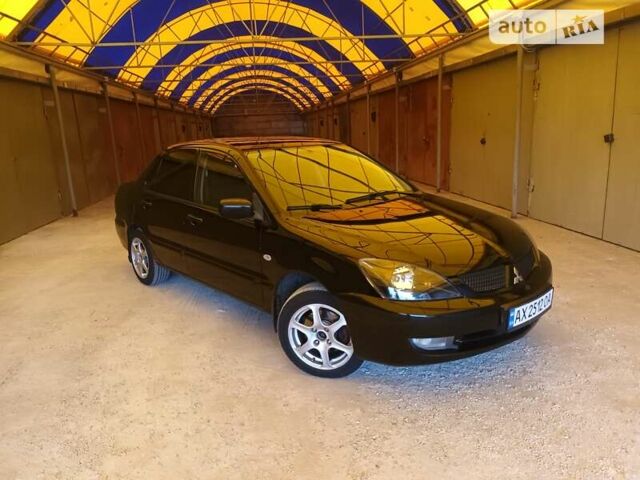 Чорний Міцубісі Lancer, об'ємом двигуна 1.58 л та пробігом 266 тис. км за 4200 $, фото 1 на Automoto.ua