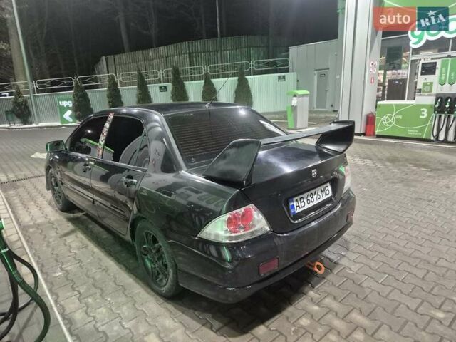 Черный Мицубиси Лансер, объемом двигателя 2 л и пробегом 289 тыс. км за 4000 $, фото 1 на Automoto.ua