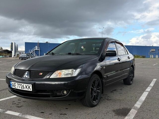 Чорний Міцубісі Lancer, об'ємом двигуна 1.58 л та пробігом 240 тис. км за 4099 $, фото 1 на Automoto.ua