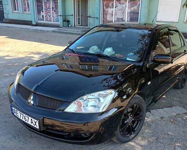 Чорний Міцубісі Lancer, об'ємом двигуна 1.6 л та пробігом 240 тис. км за 5400 $, фото 1 на Automoto.ua