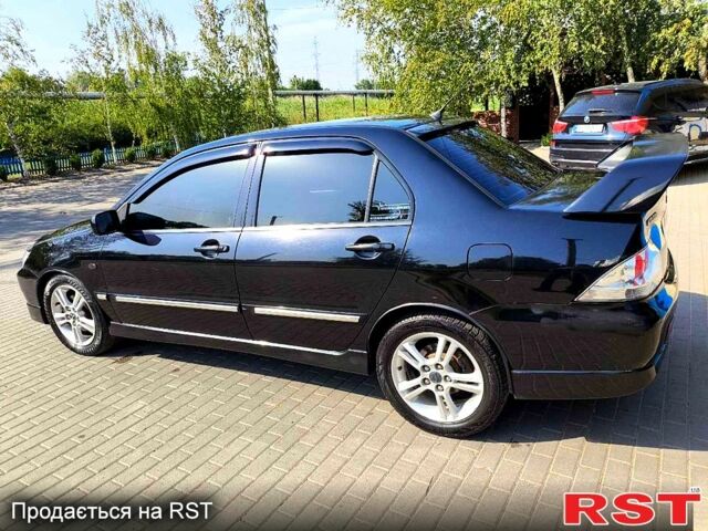 Чорний Міцубісі Lancer, об'ємом двигуна 2 л та пробігом 240 тис. км за 5600 $, фото 1 на Automoto.ua