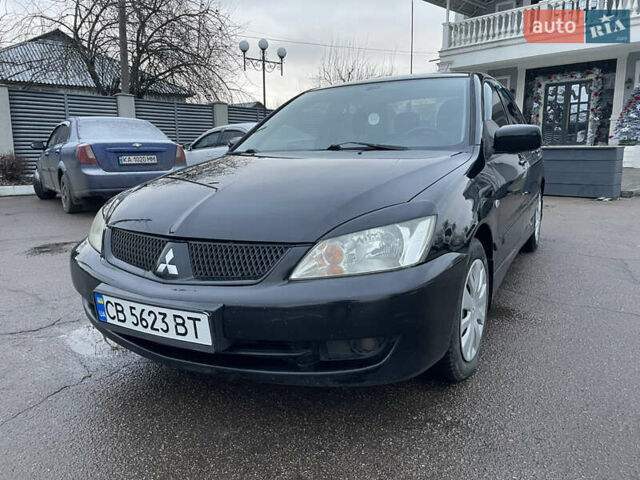 Чорний Міцубісі Lancer, об'ємом двигуна 1.58 л та пробігом 196 тис. км за 3800 $, фото 1 на Automoto.ua